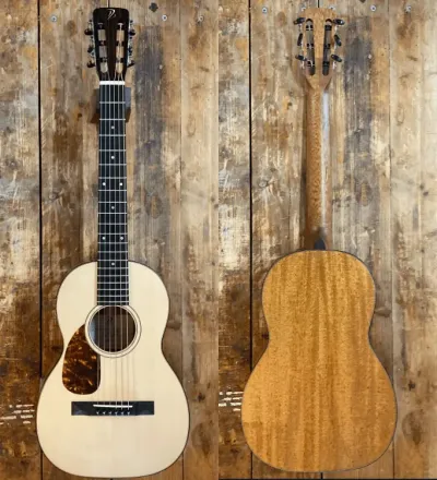 Front and back views of a light-colored acoustic guitar with a wooden body.