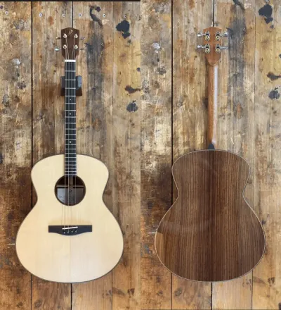 Front and back views of an acoustic guitar with a light top and dark wood back.